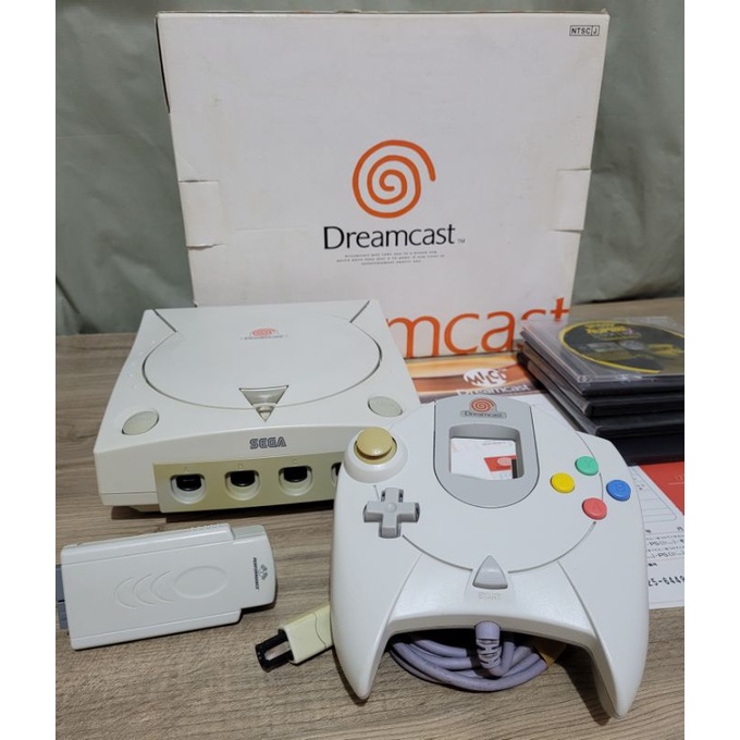 Dreamcast na Caixa com serial batendo + controle, tremor Pak e