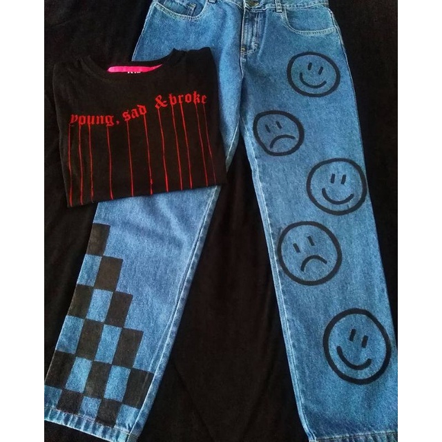 Calça jeans com store desenhos