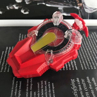 Um Lançador De Beyblade Vermelho Foto de Stock - Imagem de grânulo