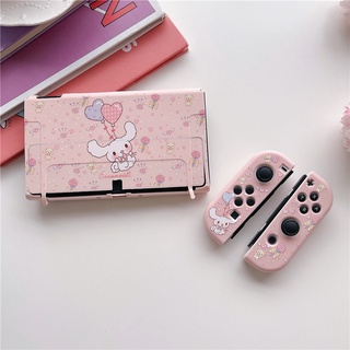 Uma consola de jogos nintendo com uma capa rosa e azul.