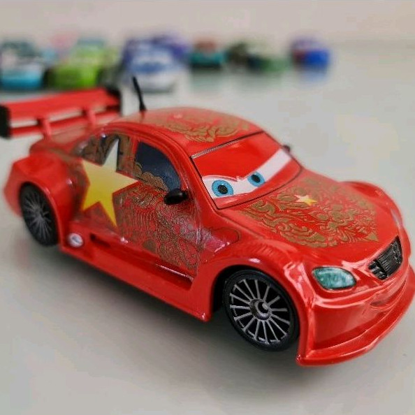 Long Ge (11cm Maior) Miniatura Filme Carros 2 Disney Pixar