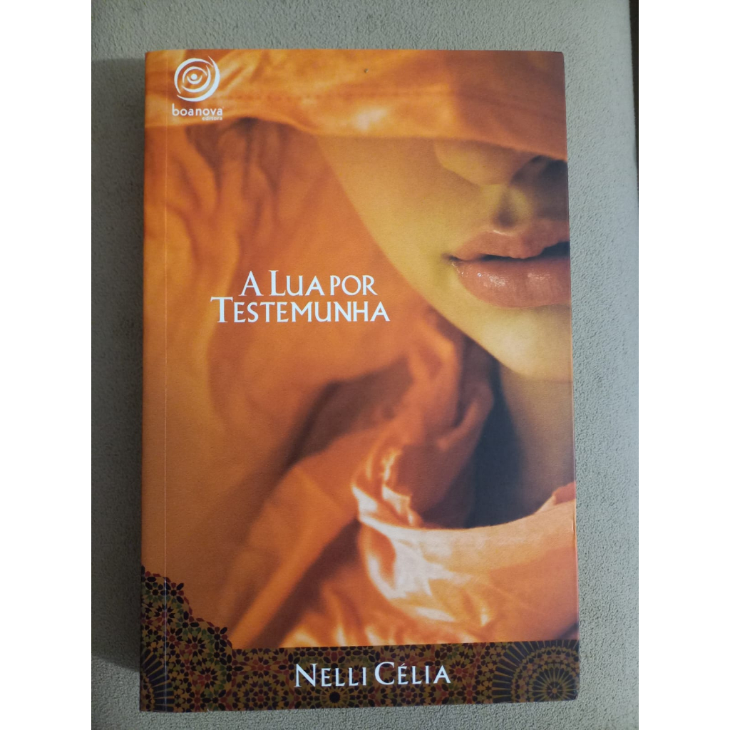 Livro: A Lua por Testemunha -NOVO- Nelli Célia | Shopee Brasil