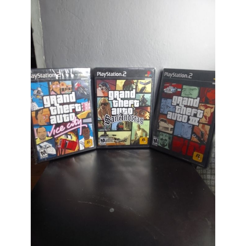 GTA San Andreas Sur PS2 (Sony PlayStation 2) – Blister Scellé - Édition US Trilogie - Pièce Or 90 MT