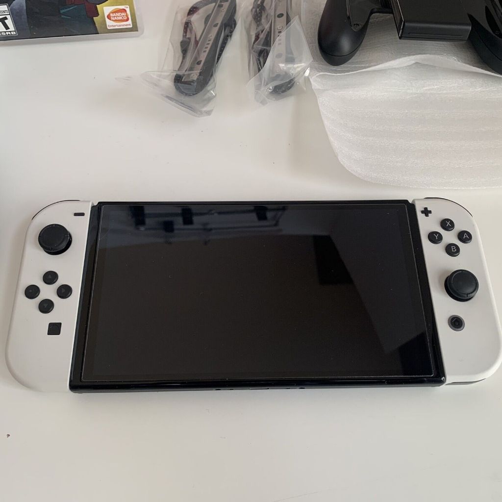 Console portátil Nintendo Switch OLED - 64GB - Branco com controle profissional/jogo