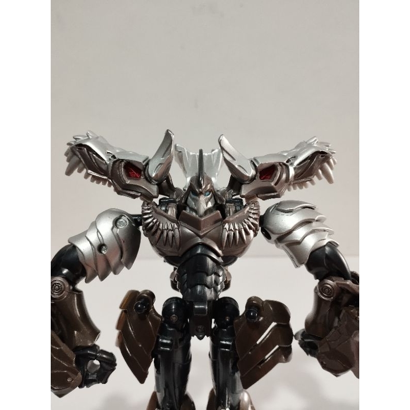 Boneco Grimlock Transformers Dino Vira Robô 18cm Cinza | Shopee Brasil