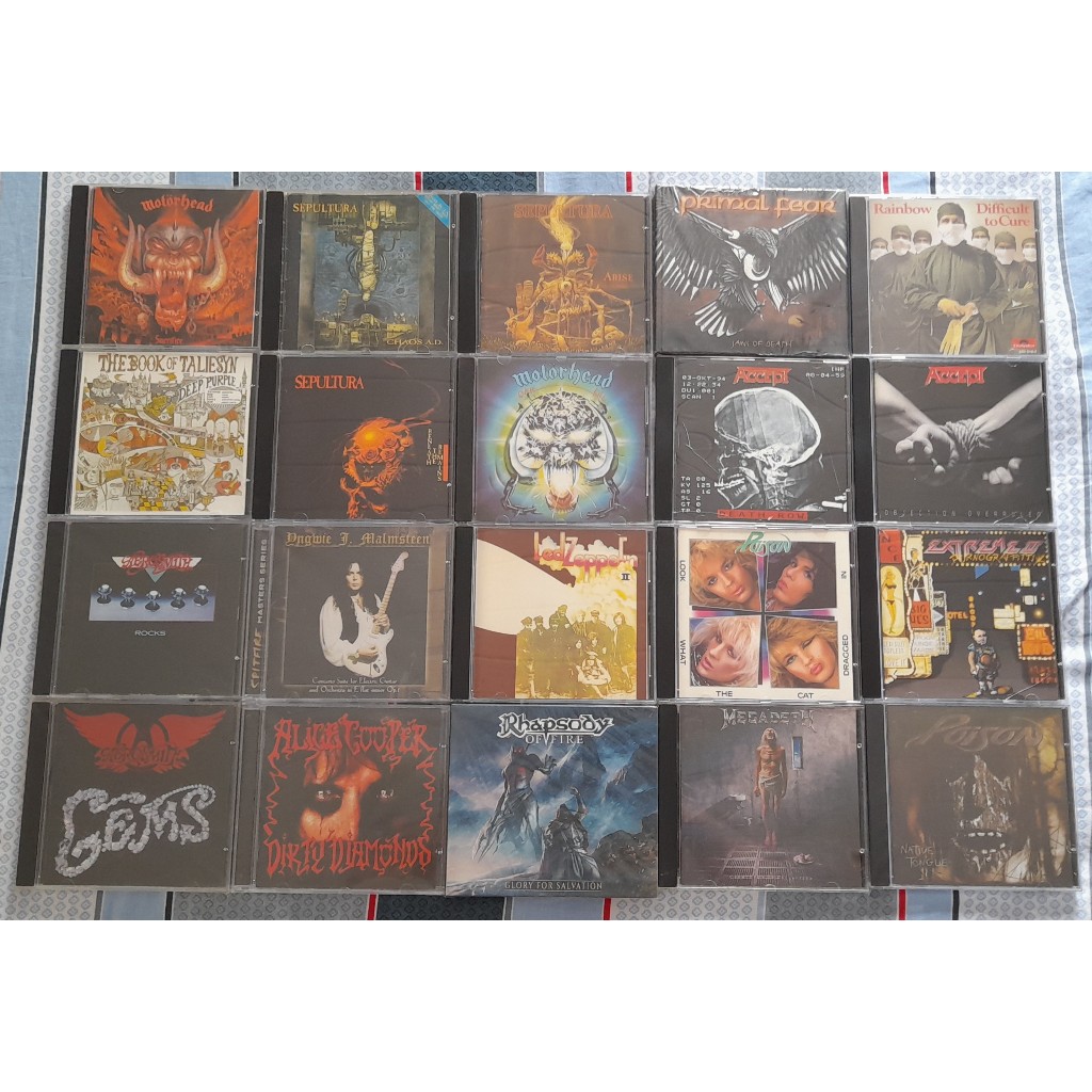 CDs de Heavy metal (Sepultura, Deep Purple, Led Zeppelin, Alice Cooper, Primal Fear, Aerosmith, Rhapsody, Megadeath, Motothead, Yngwie Malmsteen, Poison, Rainbow, Extreme))