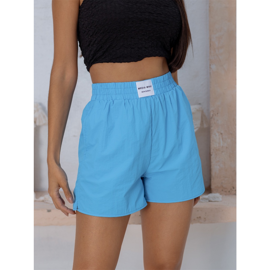 Short tecido hot sale cos alto