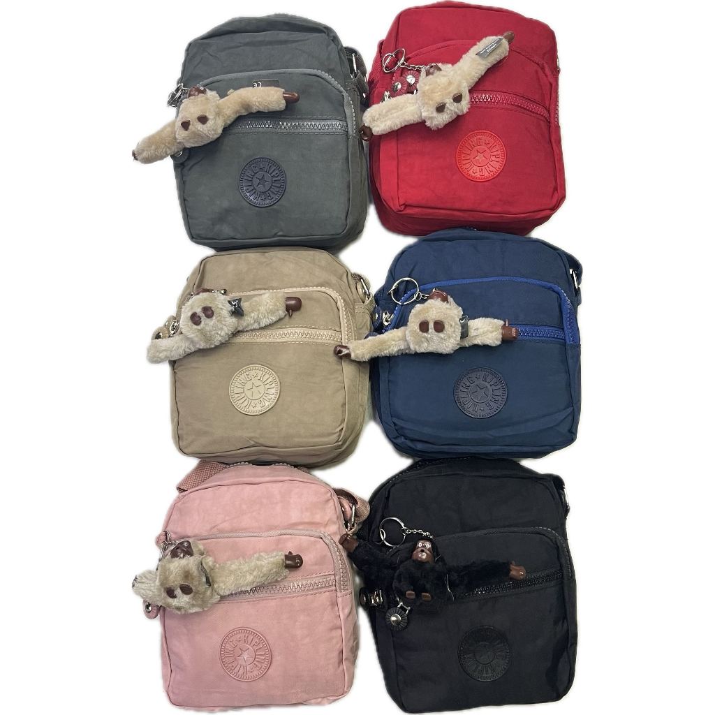 Bolsa feminina pequena casual de nylon crossbody e chaveiro de macaco