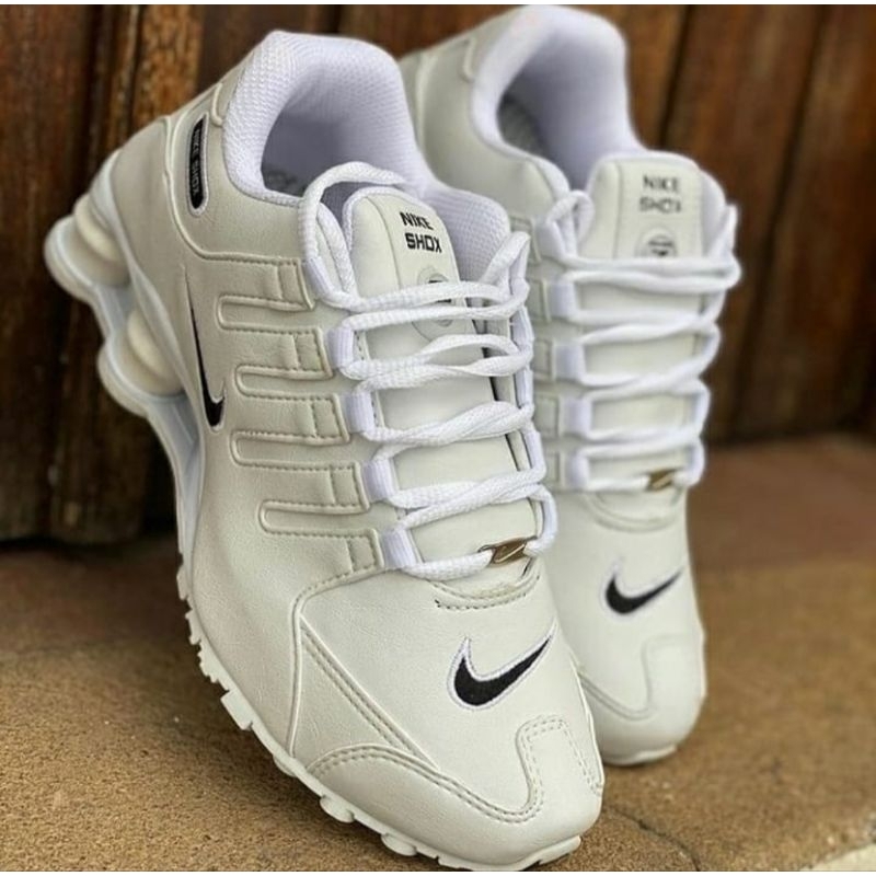 Nike shox donna oro online