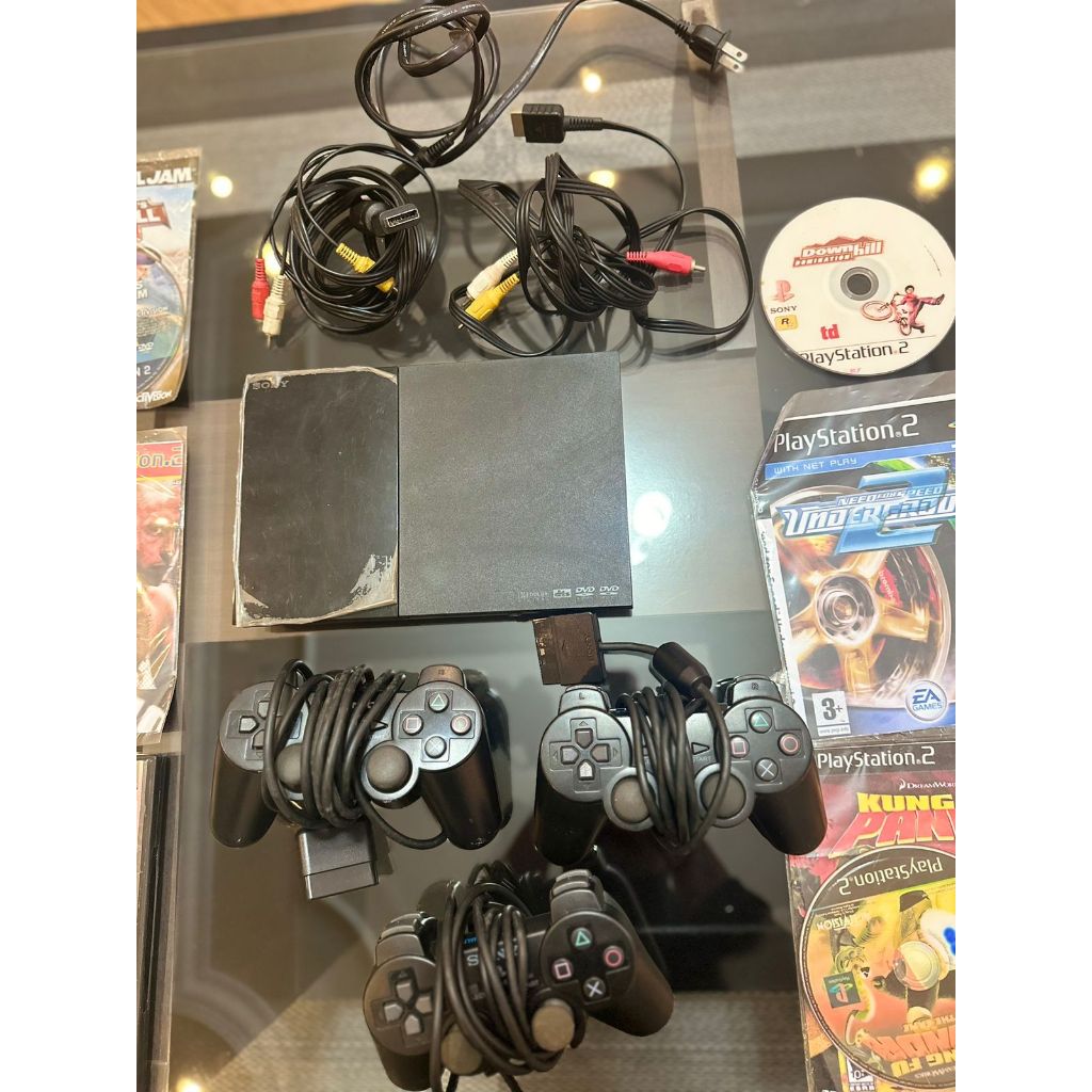 playstation 2 slim + jogos - funciona corretamente! acompanha cabos e controles