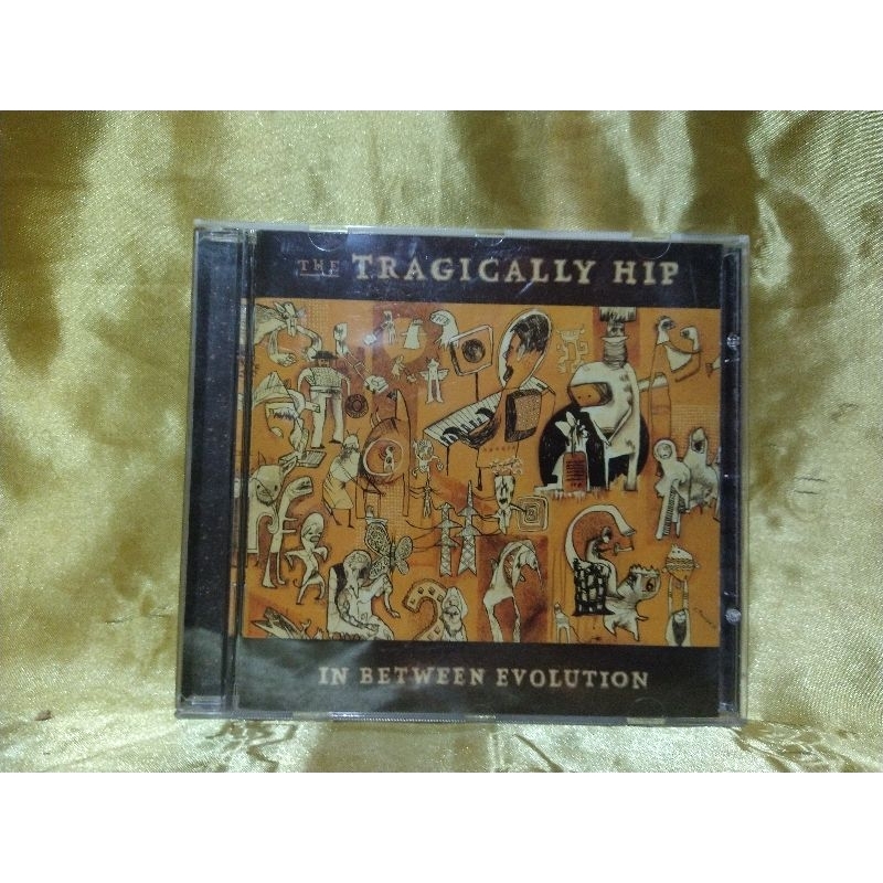 Cd The Tragically Hip - In Between Evolution | Shopee Brasil