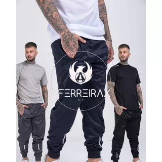 KIT 3 CALÇAS JOGGER MASCULINAS ESPORTIVA COM SIMBOLO REFLETIVO QUE BRILHA NO FLASH DO CELULAR