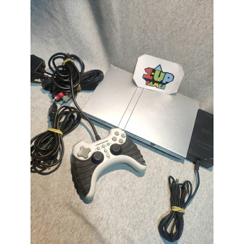 videogame antigo p.s2 prata scph 79001. desblo.queado. não lê dvd. controle trustmaster, fonte e cabo av. bom pra opl