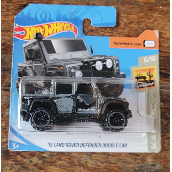 Hot Wheels - '15 Land Rover Defender Double Cab Cinza Camuflado - Baja Blazers 2019 (Lacrado) - Main Line 1:64