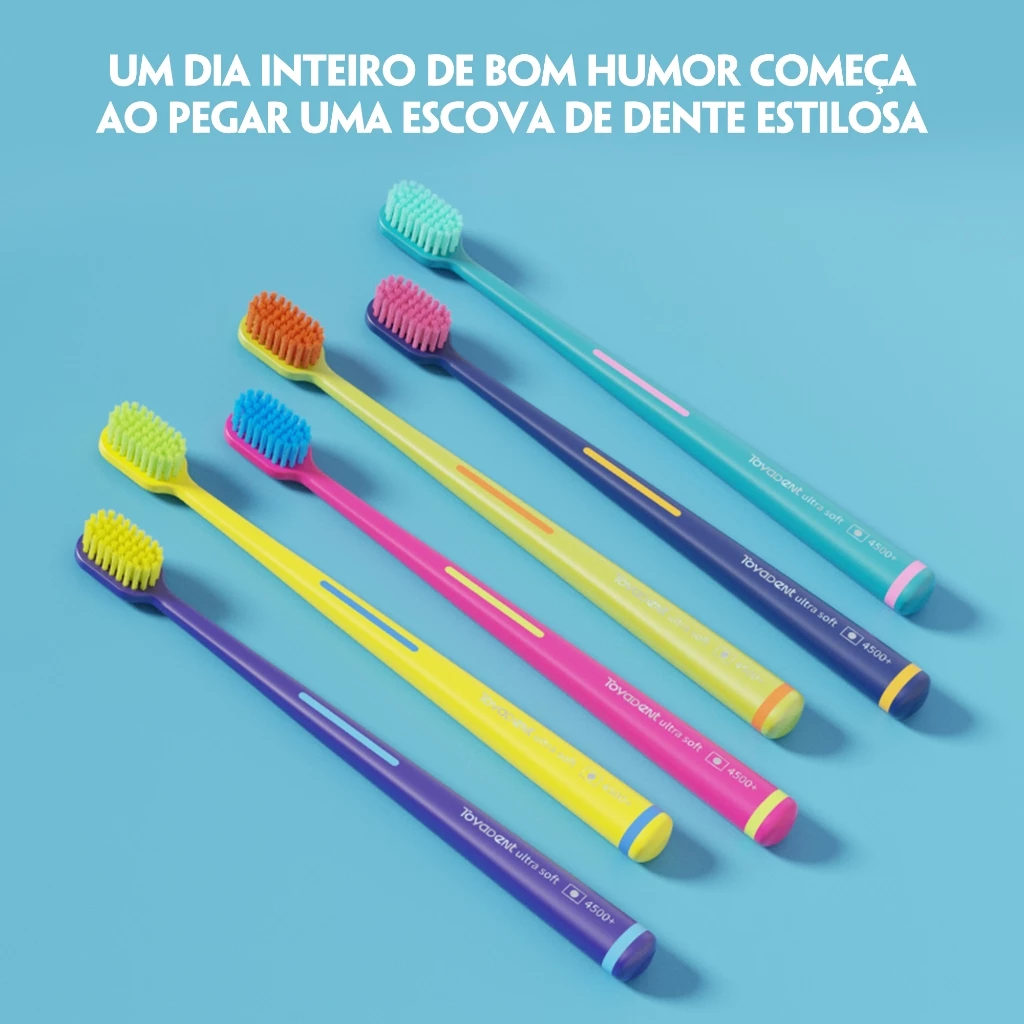 Cinco escovas de dente Toyadent com cores vibrantes dispostas diagonalmente sobre fundo azul