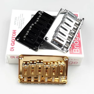 Ponte Fixa Para Guitarra Elétrica GOTOH GTC102 Original Genuína Com Acabamento Em Sela De Aço Cromado Preto Dourado