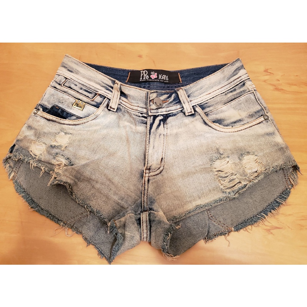 Shorts jeans curto na best sale frente e comprido atrás