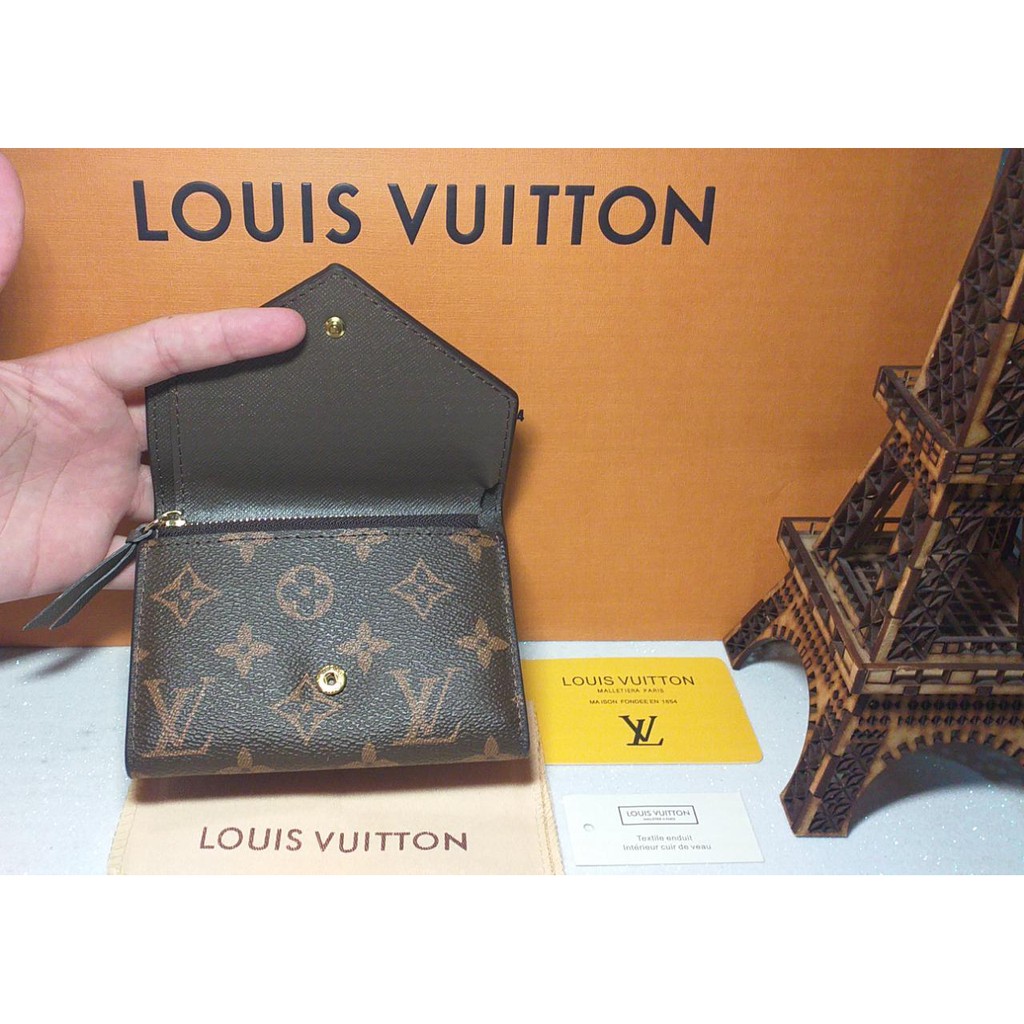 Preços baixos em CARTEIRAS femininas Louis Vuitton Marrom