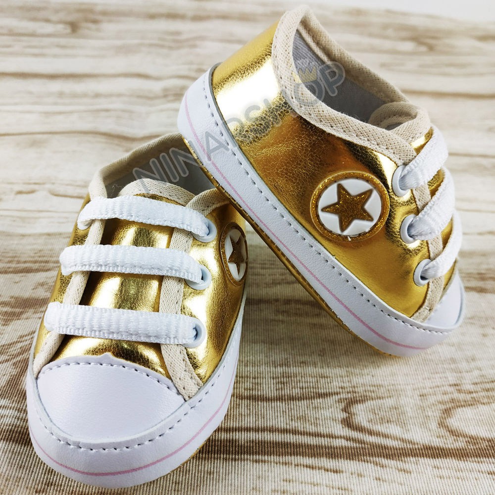 Tenis sales bebe dourado