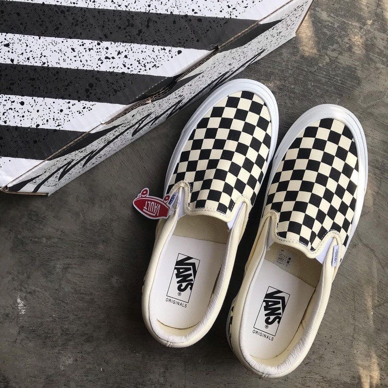 Vans slip on clearance quadriculado preto e branco