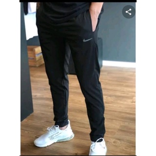 Calça tactel nike com elastico 2024 na barra