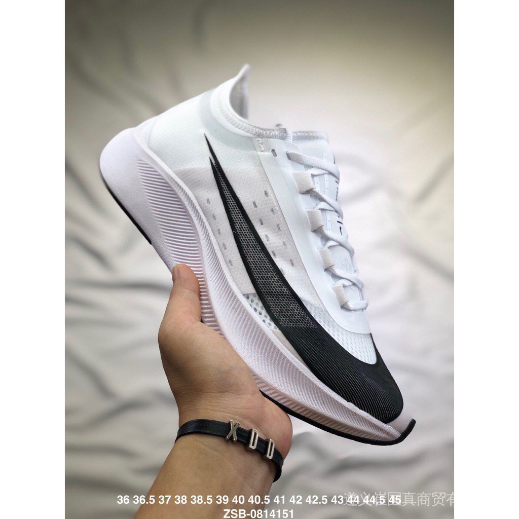 Nike zoom fly triple hot sale white