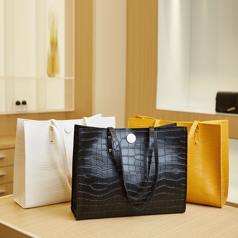 Bolsa Fêmea 2024 Novo Estilo Simples Casual de Quatro Folhas de Trevo Impresso em Tote de Grande Capacidade Padrão de Crocodilo em relevo