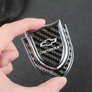 Logotipo Do Carro Autocolante Emblema Cromado 3D Metal Fibra De Carbono Da Carroceria Aro Vip Decalques Para Chevrolet Trax Cruze Blazer Astro Camaro Aveo Spark Sonic Optra Vela Carlo